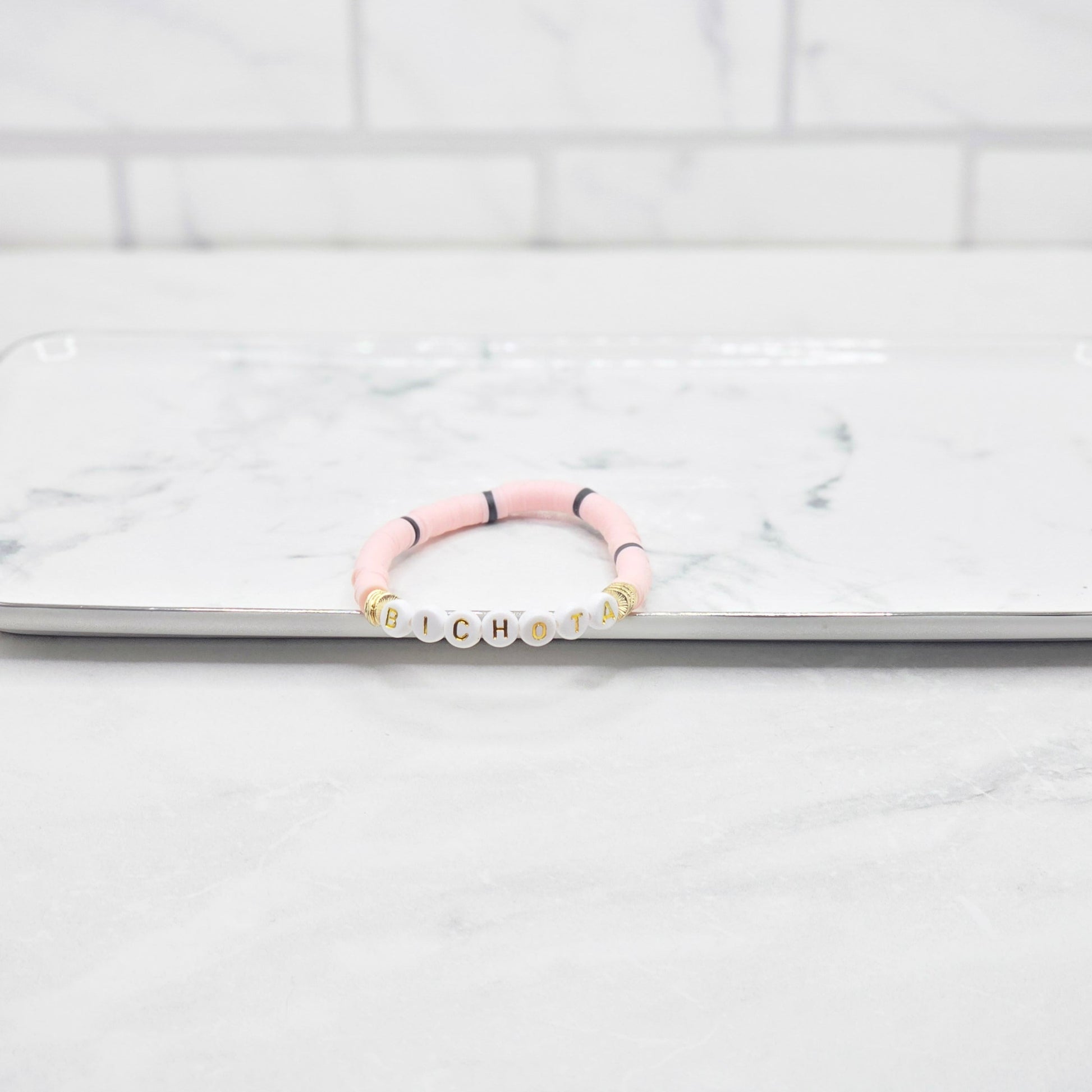 Bichota light pink & black beaded word bracelet - braceliss