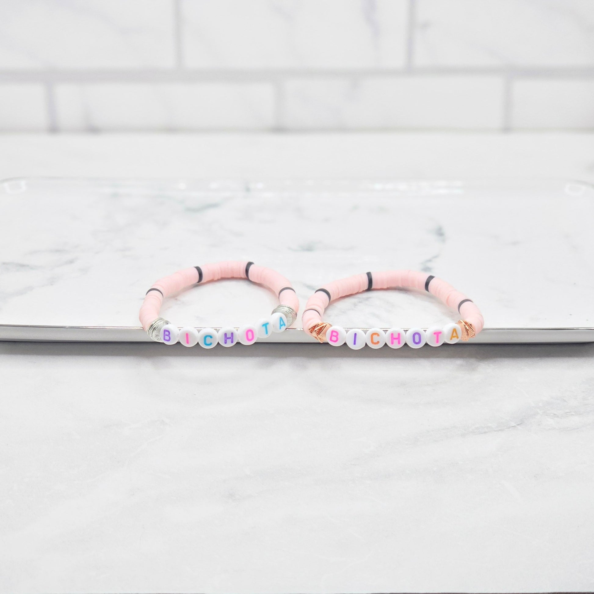 Bichota light pink & black beaded word bracelet - braceliss