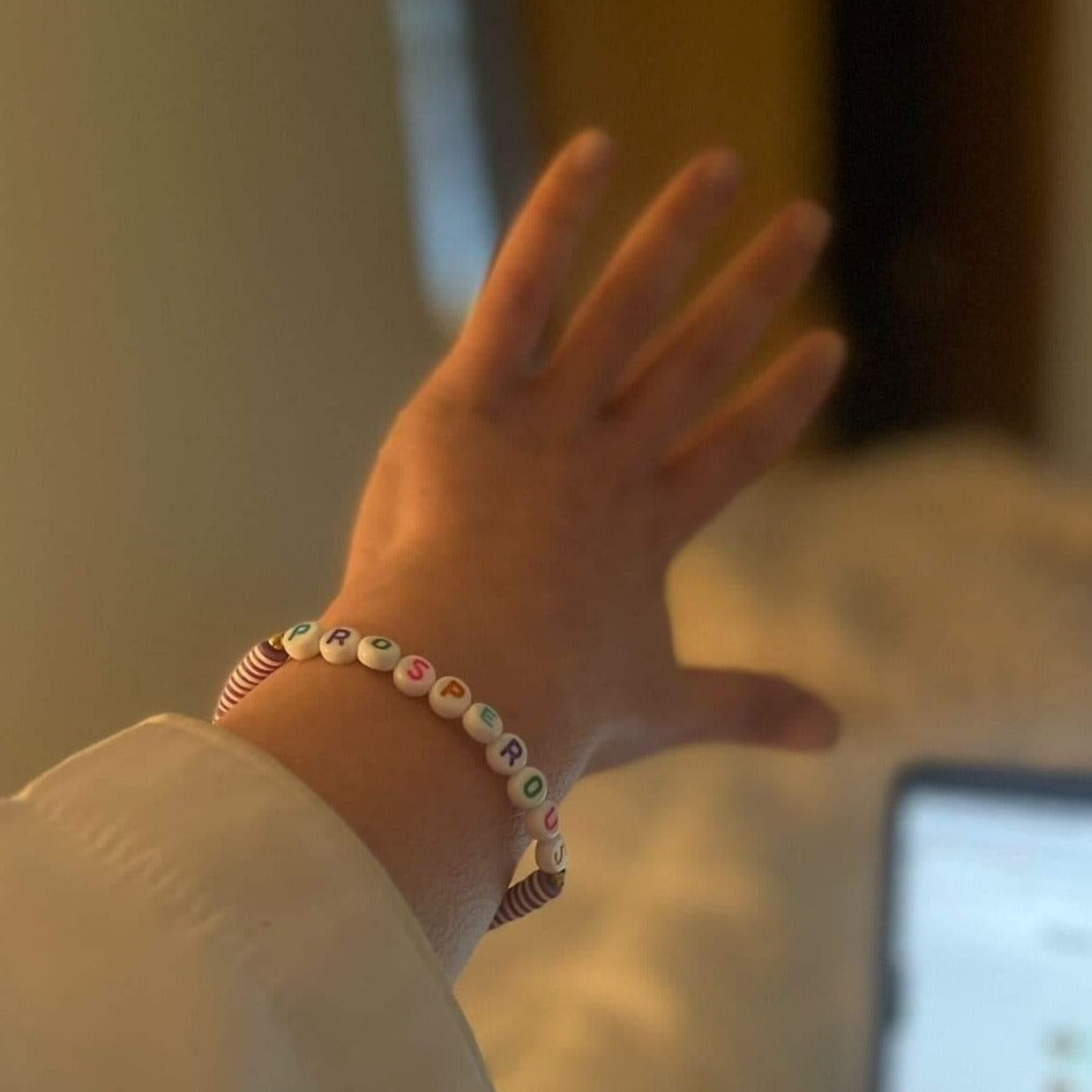 Woman wearing custom word bracelet | braceliss