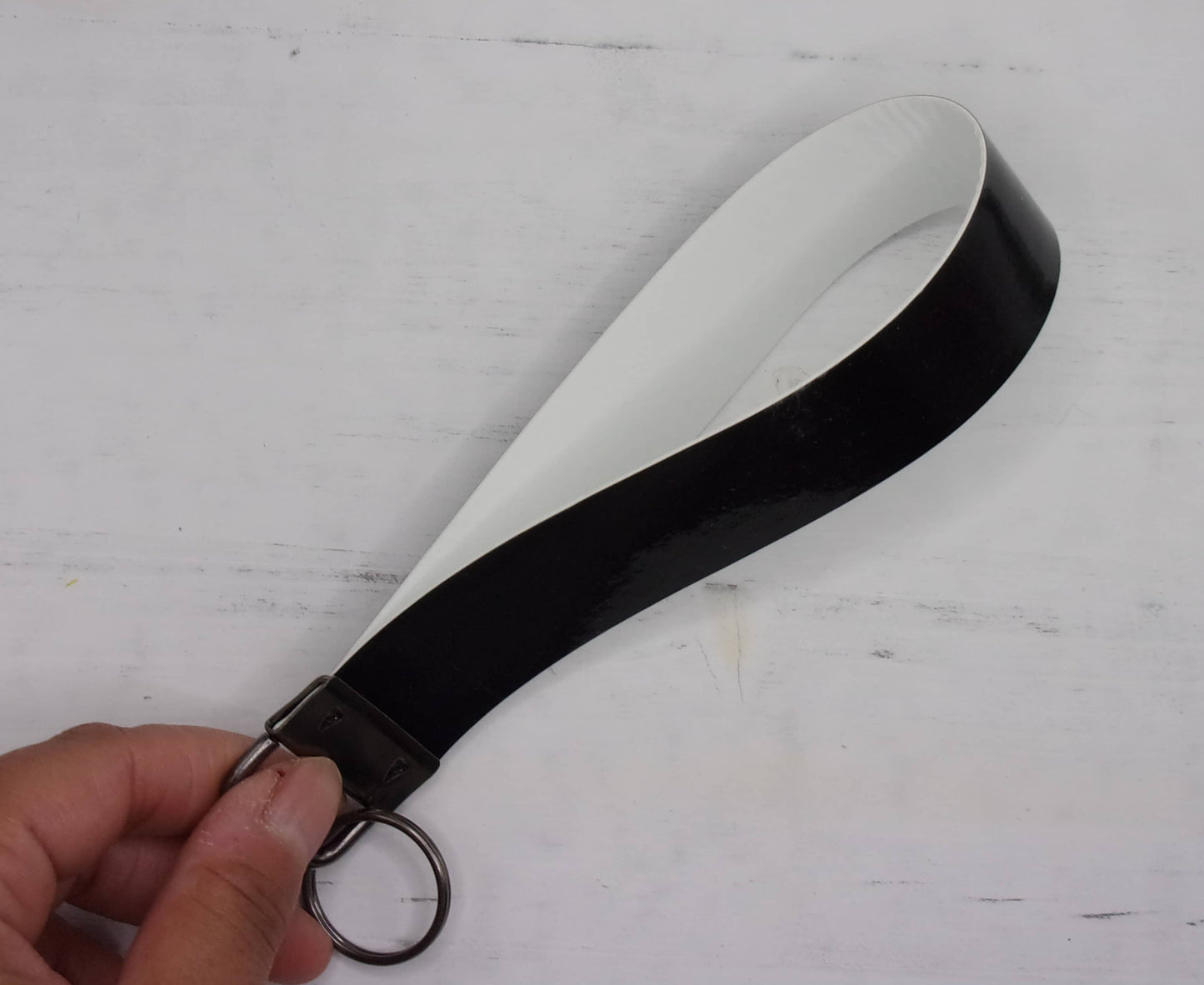 Black faux leather keyfob wristlet, sideview
