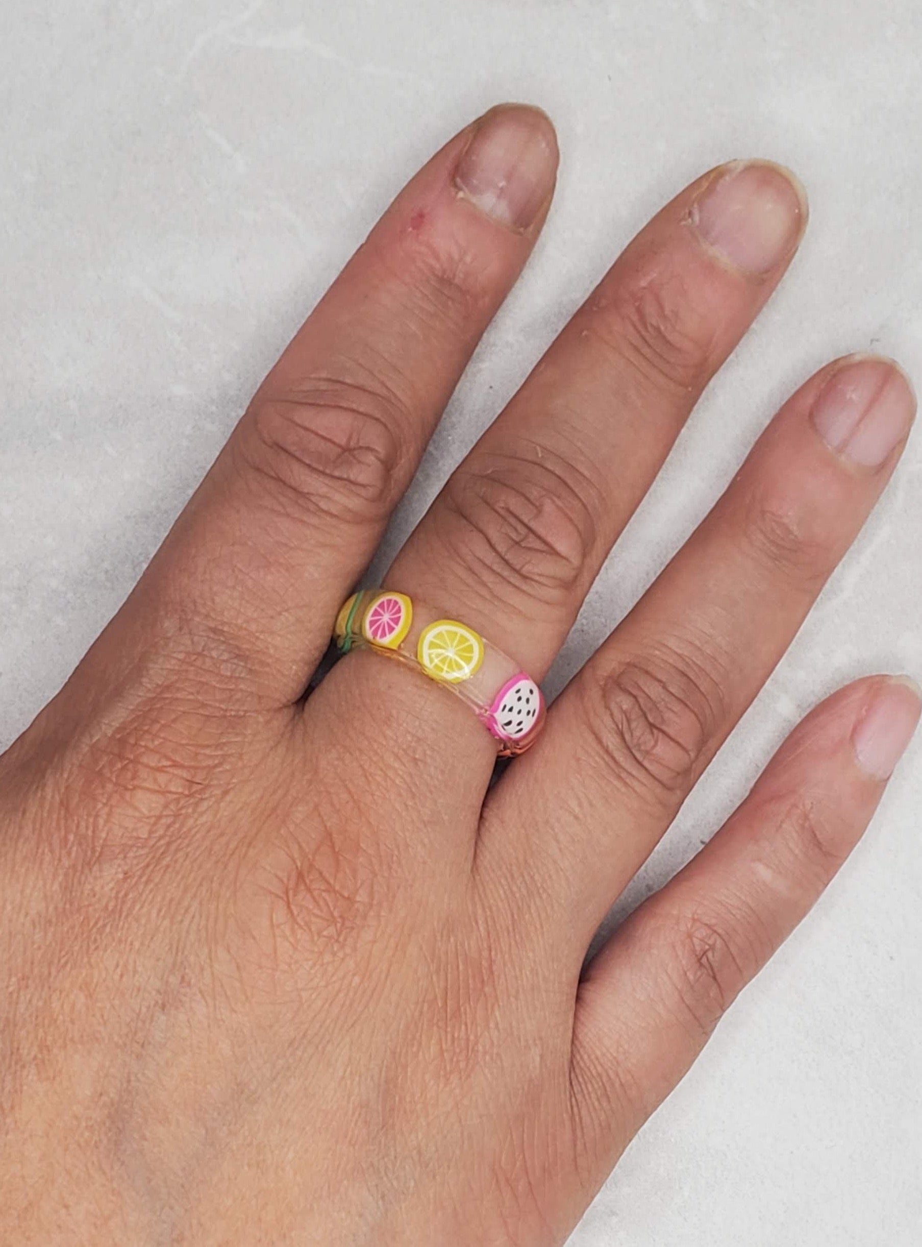 Resin ring on womanβs hand