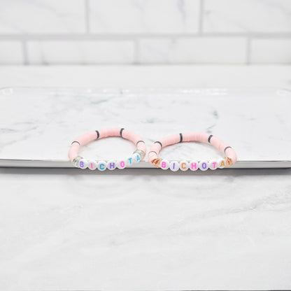 Bichota light pink & black beaded word bracelet - braceliss