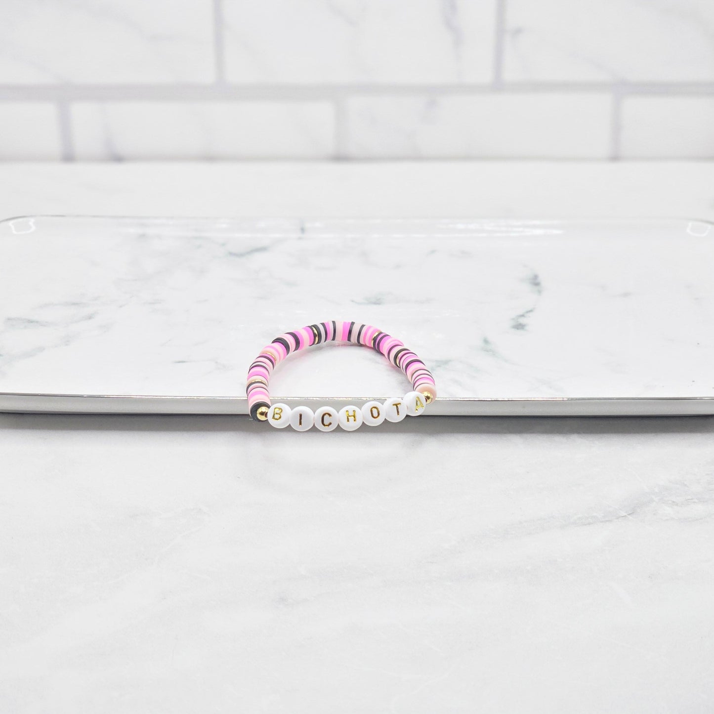 Bichota Hot pink, light pink, white & black beaded word bracelet - braceliss
