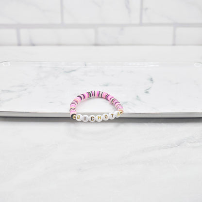 Bichota Hot pink, light pink, white & black beaded word bracelet - braceliss