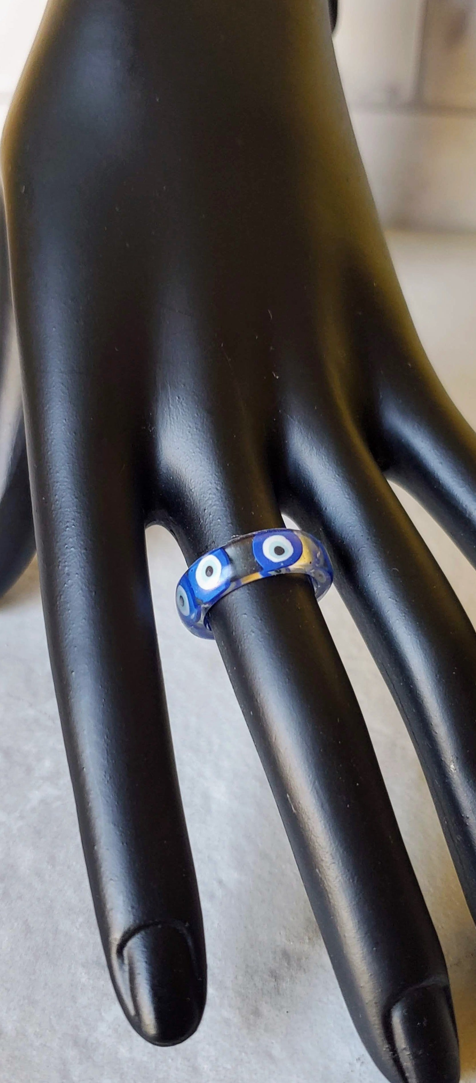 Evil eye resin ring on mannequin