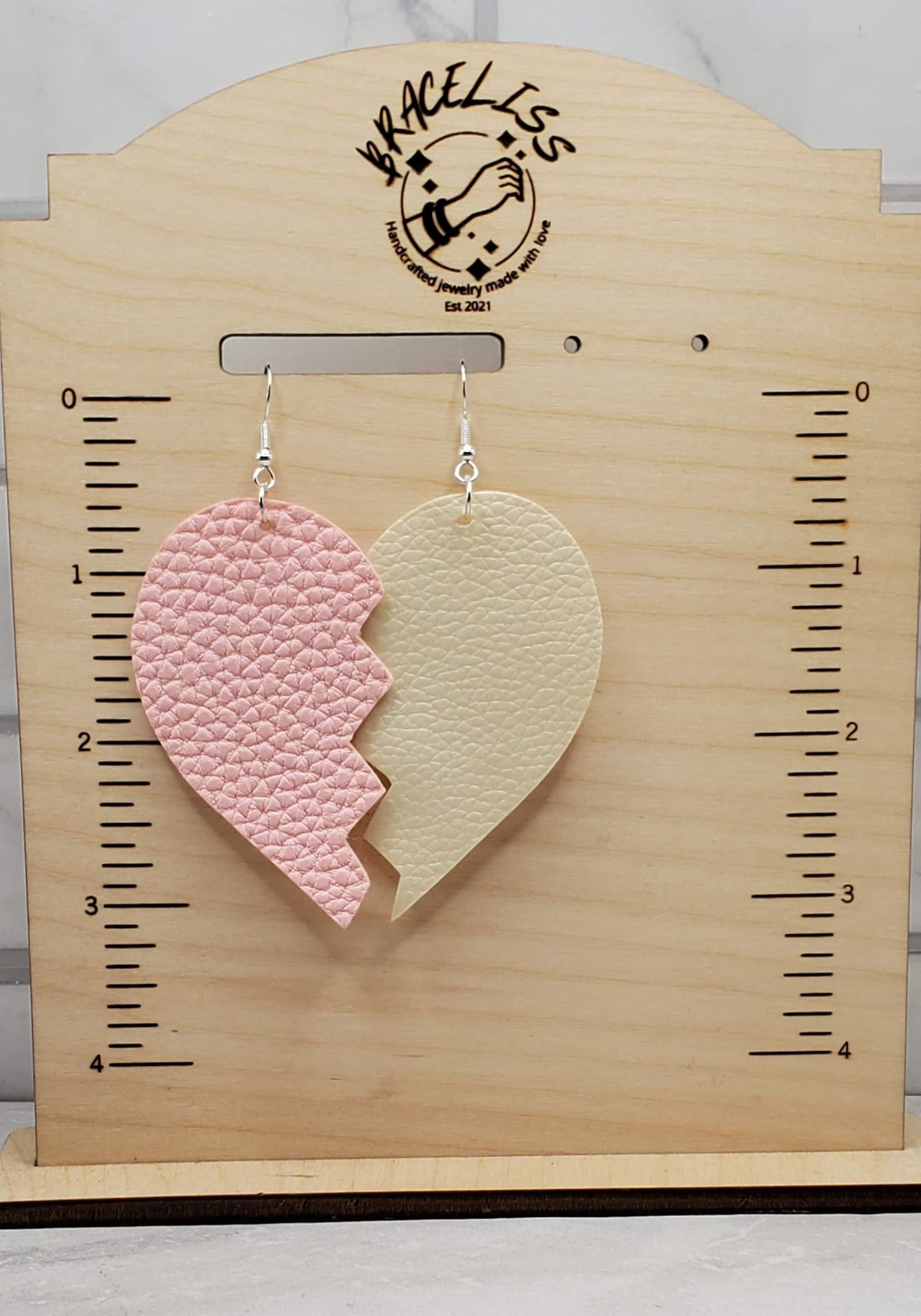 Broken Heart Earrings on measuring earring display - Braceliss