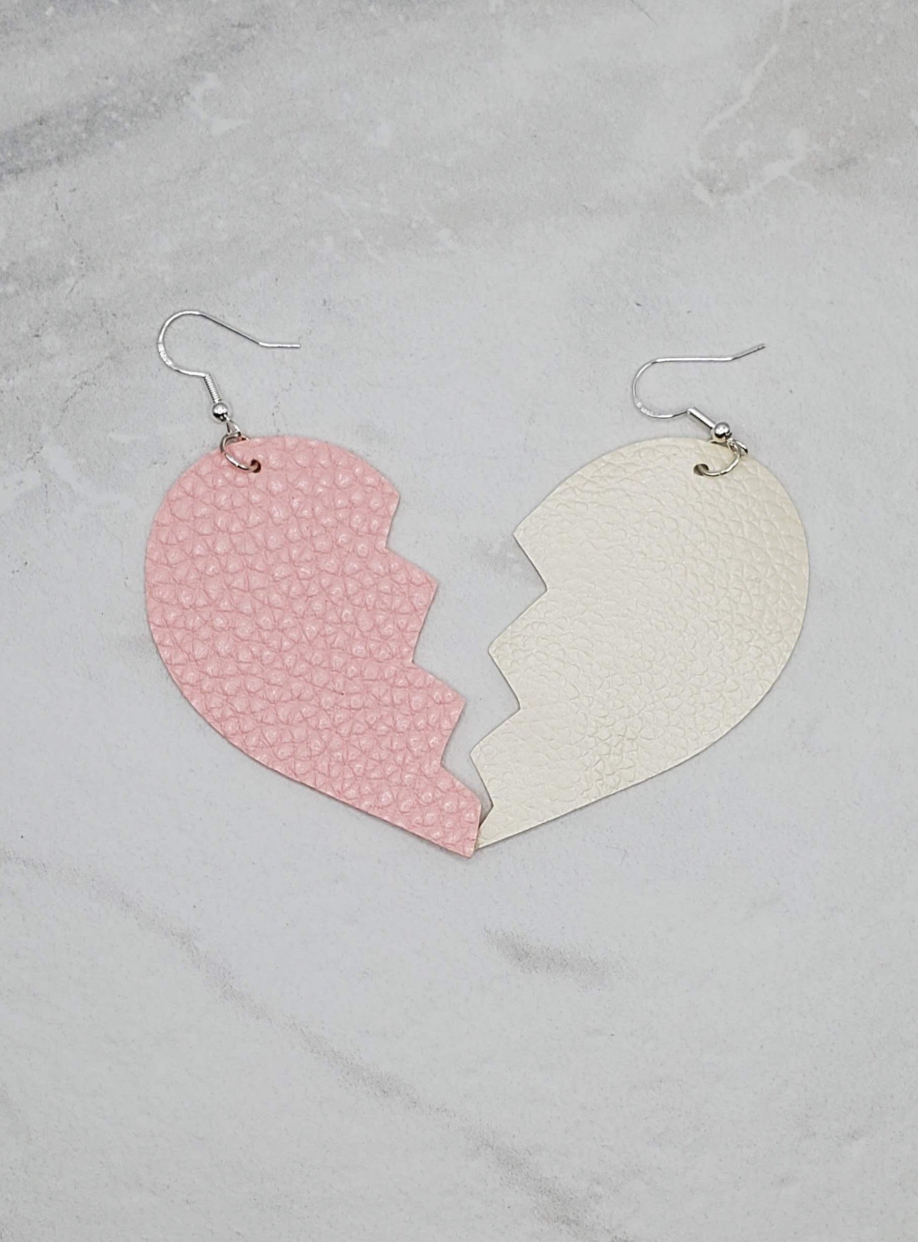Broken Heart Earrings | Pink and cream faux leather earrings flatlay | Braceliss