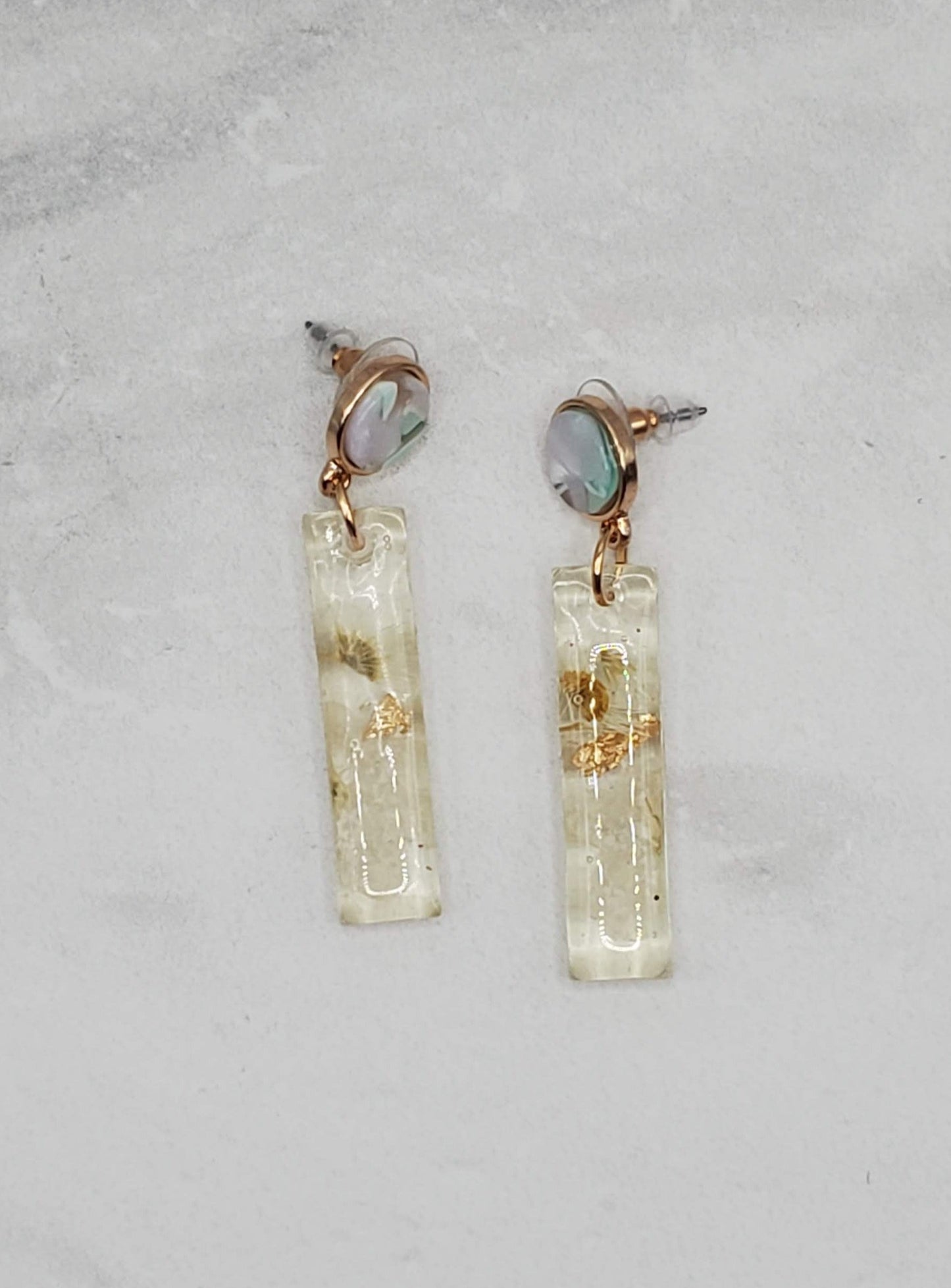 White floral bar earrings | pressed flower resin earrings flatlay | braceliss