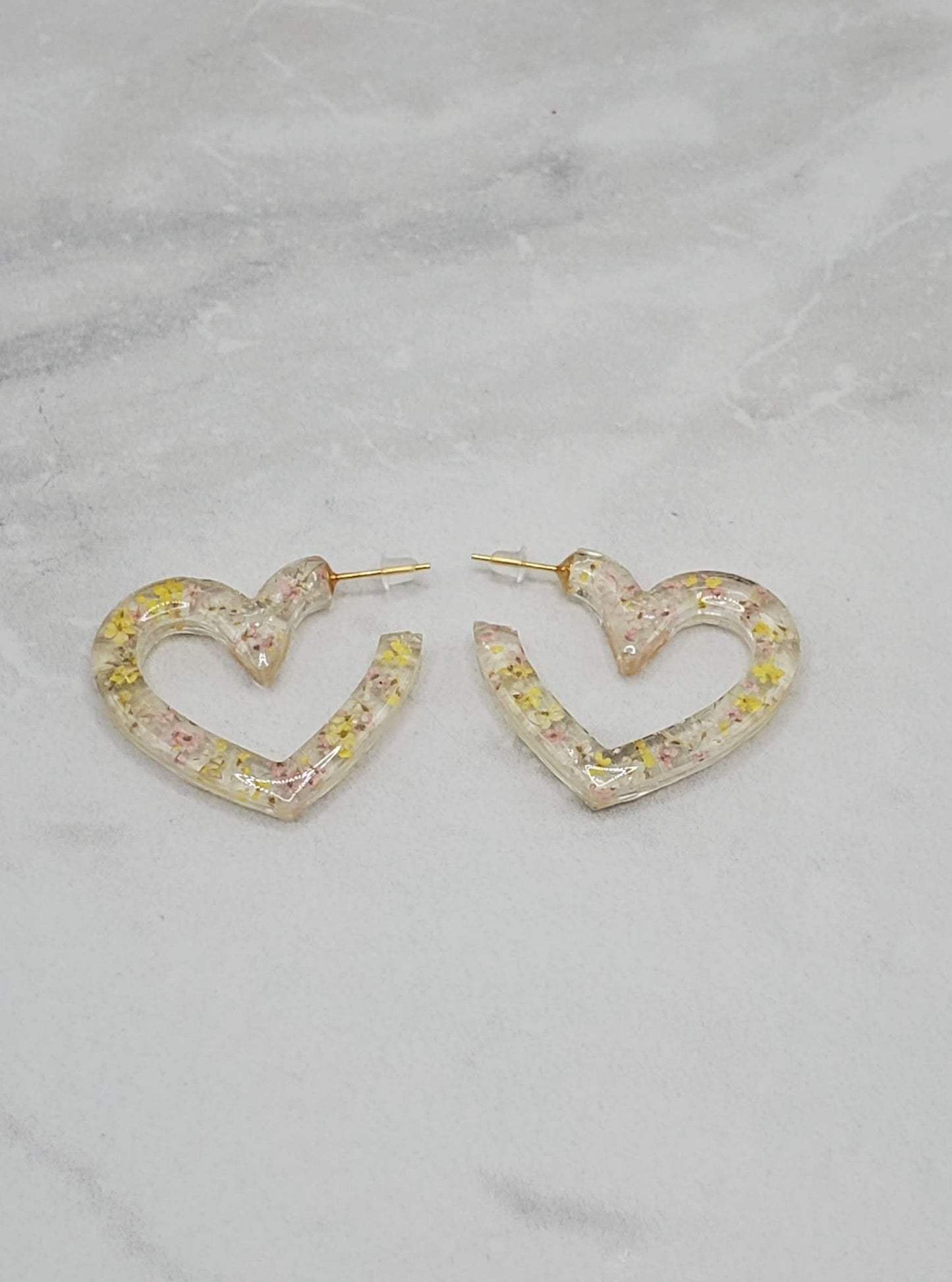 Floral heart hoops | pressed flower resin earrings flatlay | Braceliss