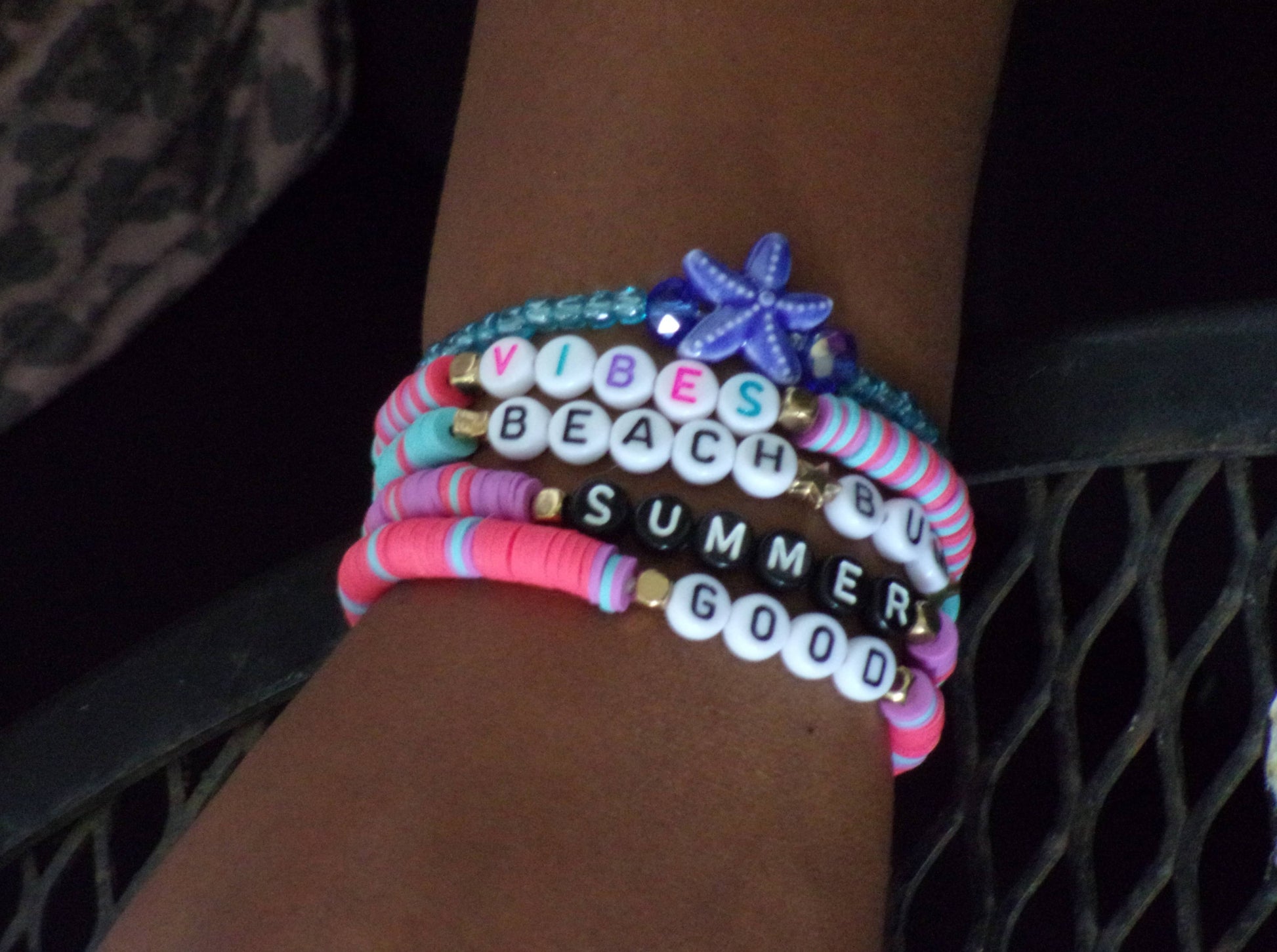 Girl wearing beach bum bracelet stack - beaded word bracelets - braceliss
