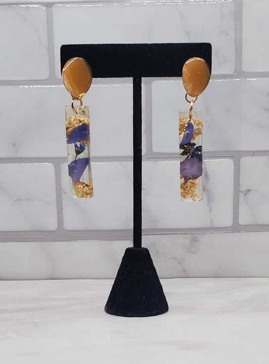 Purple floral bar earrings | pressed flower resin earrings on black earrings display | Braceliss
