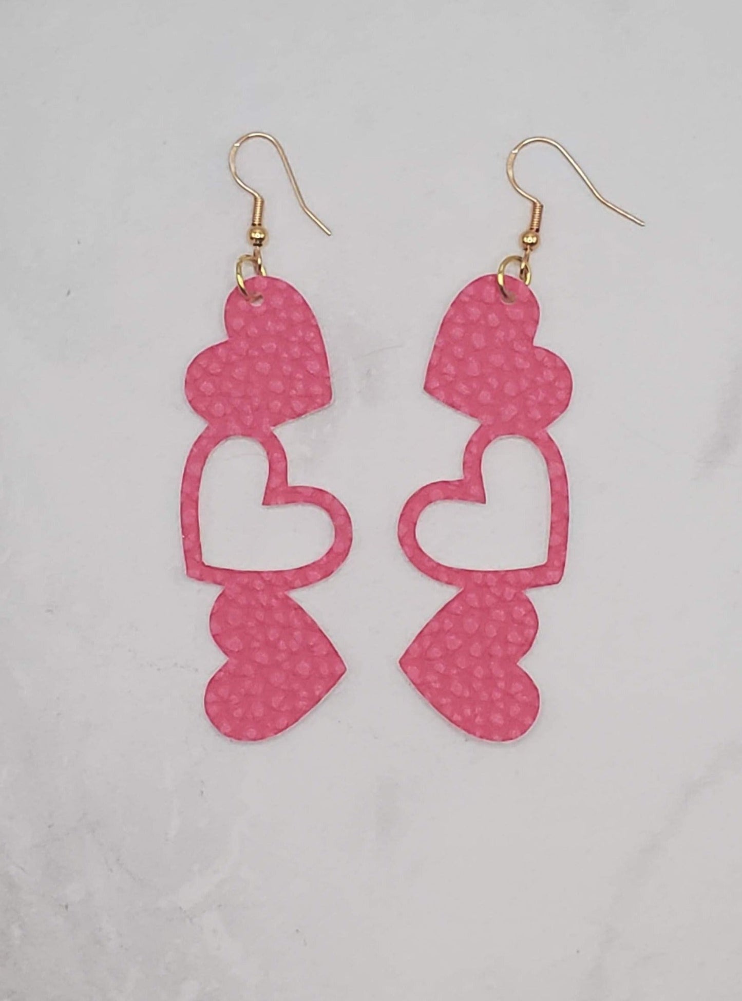 Stacked heart earrings- dark pink faux leather drop earrings - flatlay - braceliss